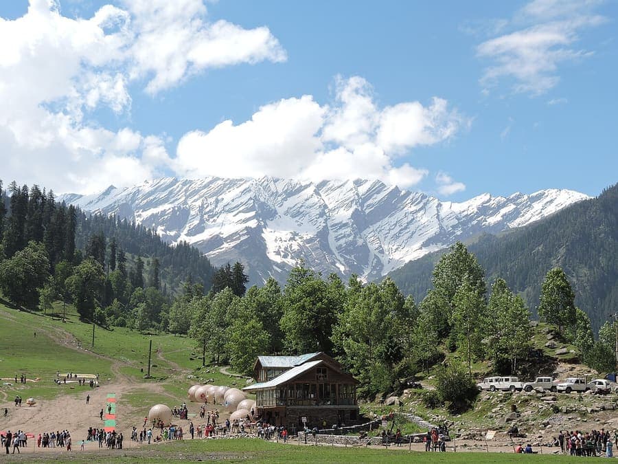 Solang Valley, Himachal Pradesh — Paragliding in summer, snow slopes in winter.