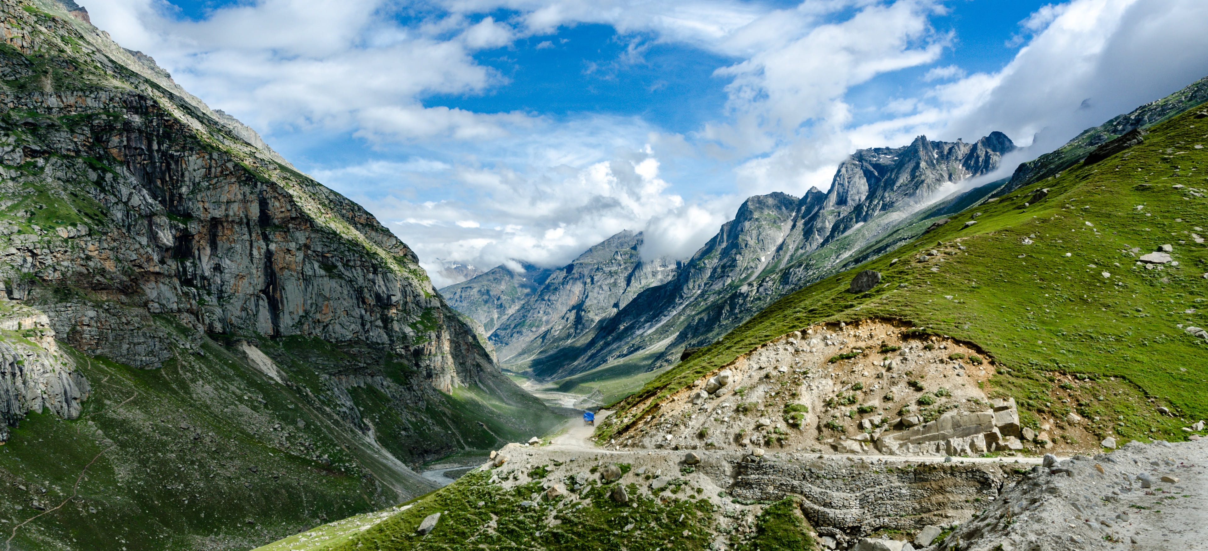 A truck on the mountain road winding down into the Spiti valley, Himalaya