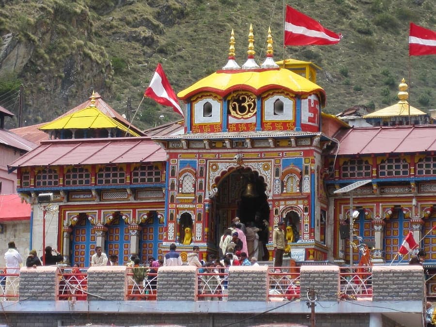 Badrinath Temple, Char Dham — Vishnu's Himalayan seat, painted and bright.