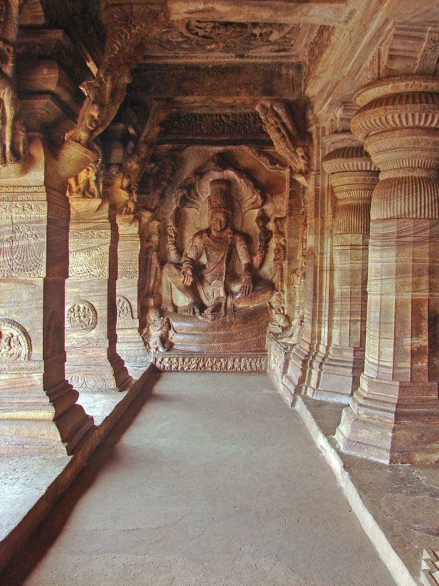 Badami Cave Temples, Karnataka — Chalukya caves cut into red sandstone.