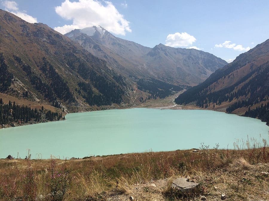 Big Almaty Lake, Kazakhstan — Turquoise water ringed by peaks.