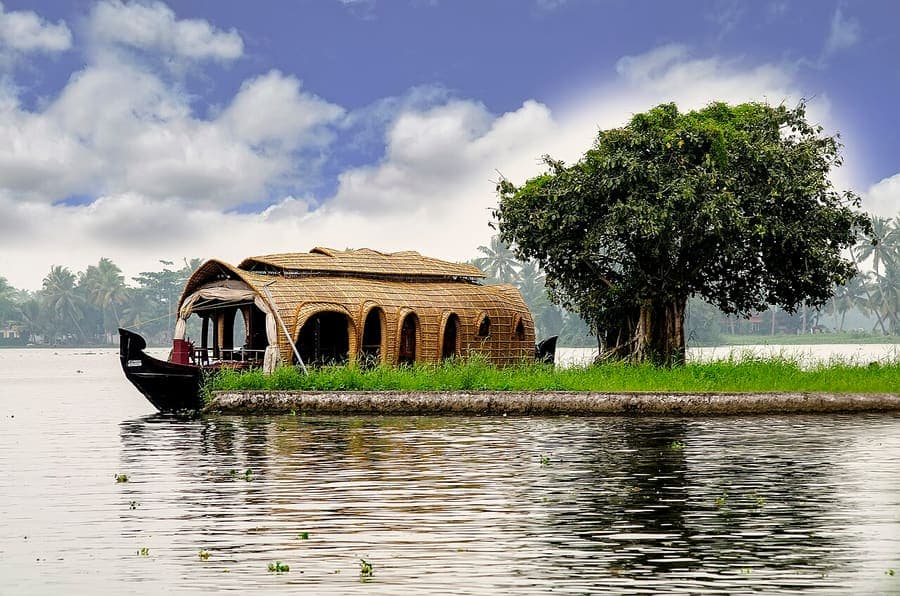 Alleppey backwaters, Kerala — Houseboats through coconut-lined canals.