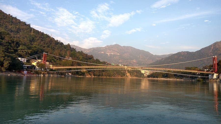 Laxman Jhula, Rishikesh — The iron footbridge over the green Ganga.